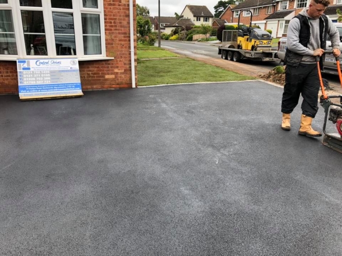 Finishing up a tarmac driveway in Solihull