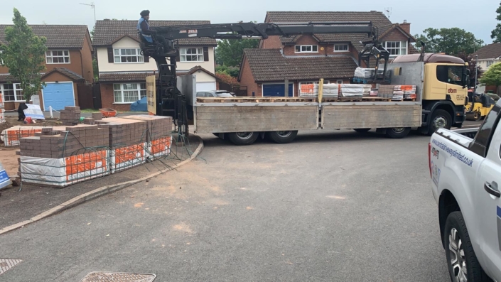 unloading materials for large block paving driveway