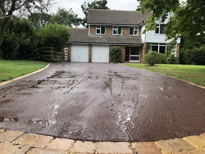 red tarmac with stone edging in Solihull
